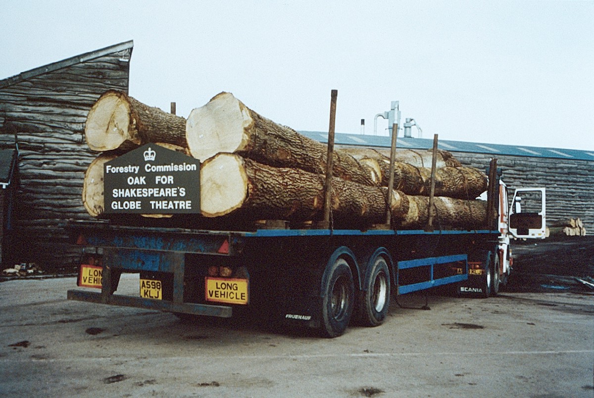 Globe Theatre Oak Large oak trees piled onto a lorry