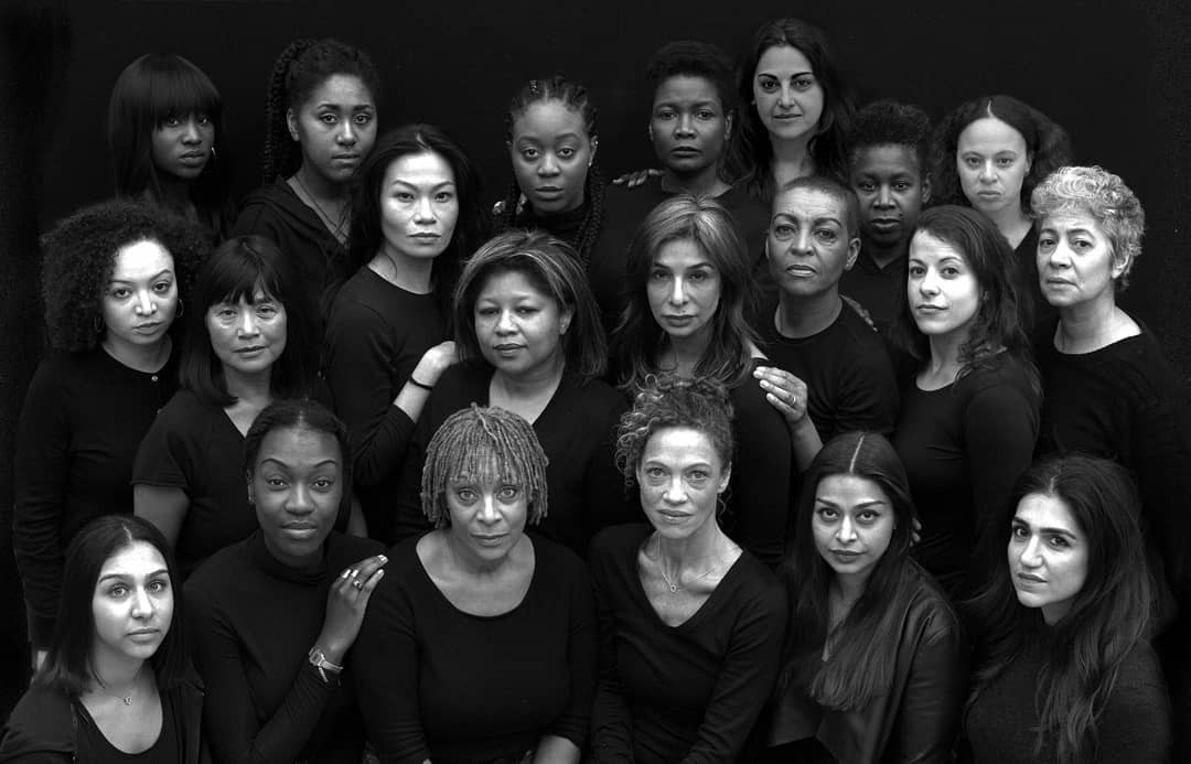 Richard II company A black and white image of many women of colour grouped together