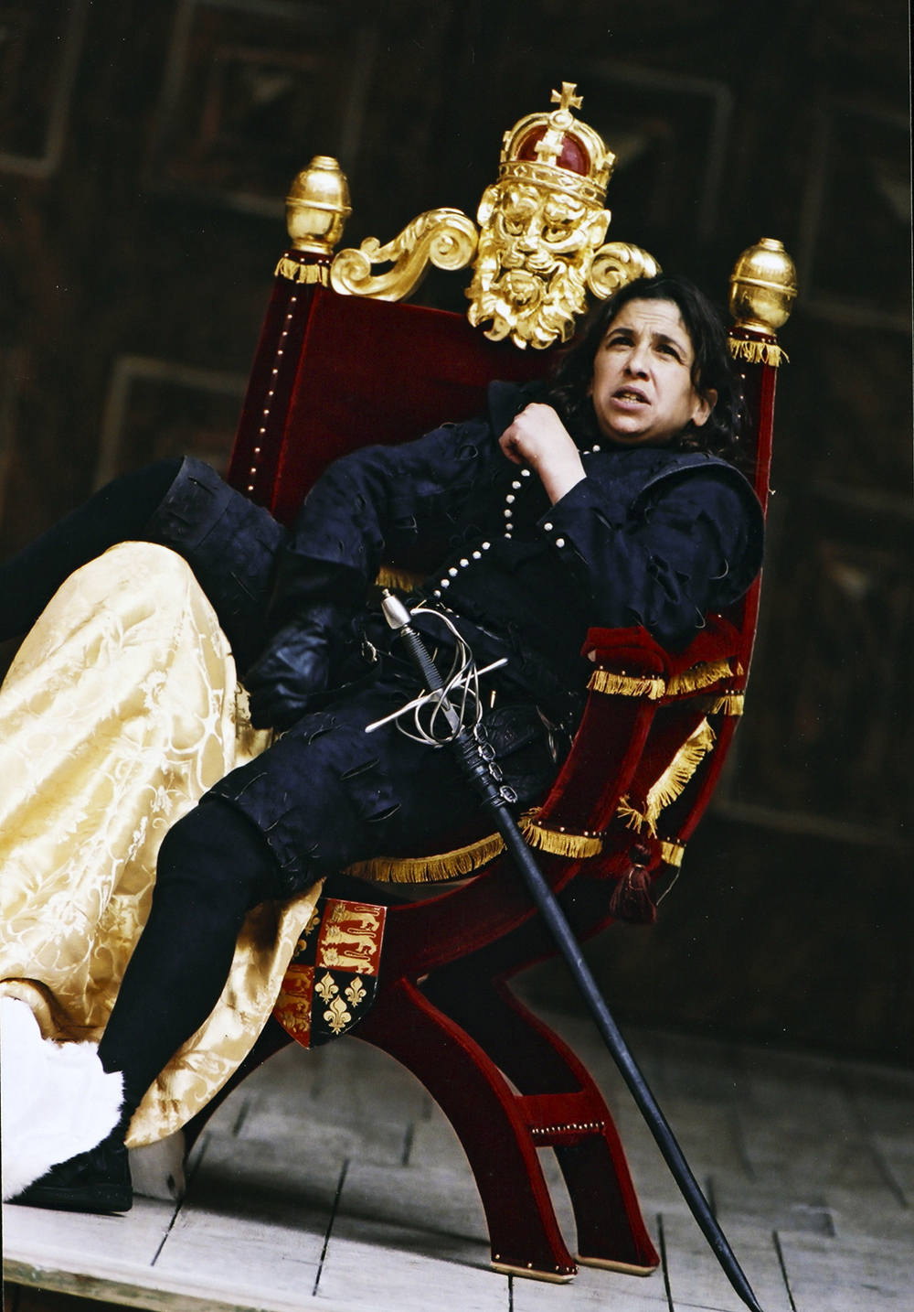 Actor sitting powerfully in a thrown