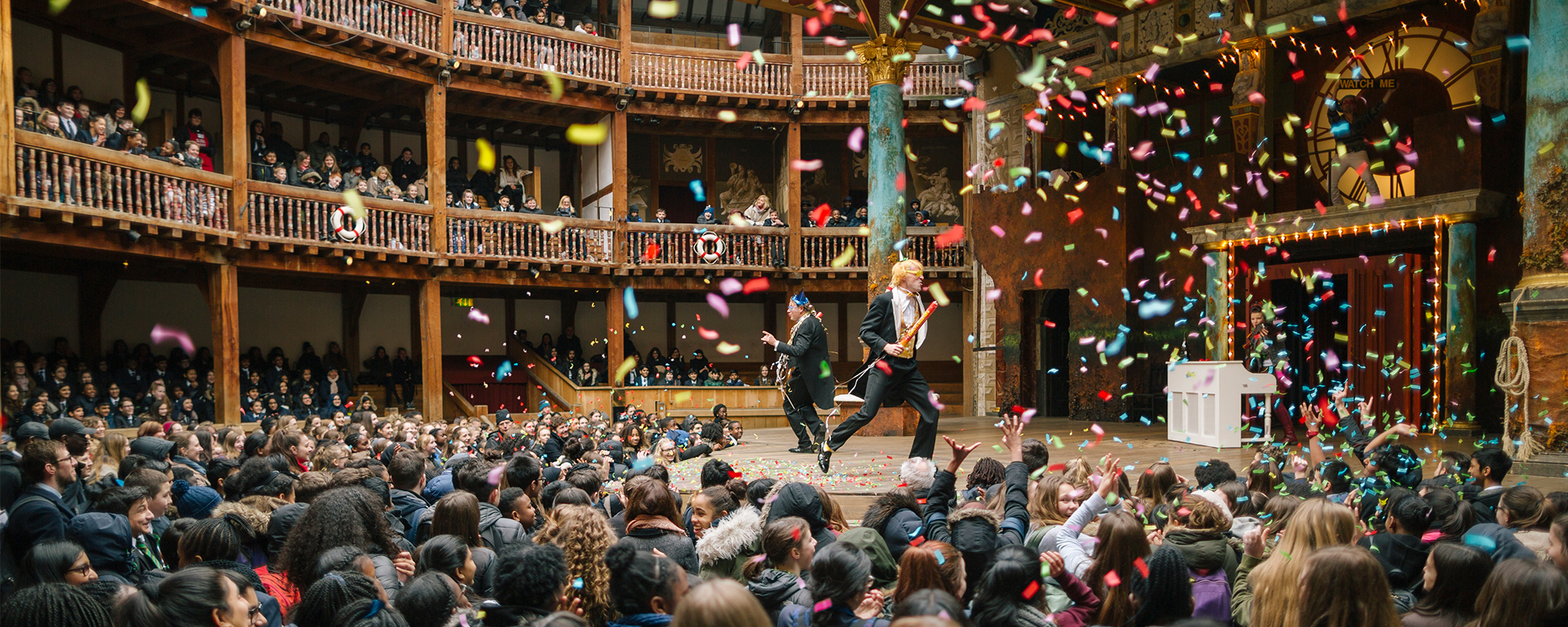 Playing Shakespeare with Deustche Bank Twelfth Night 2016 Masthead Sir Toby and Sir Andrew from Twelfth Night, dance around the stage as colourful confetti rains over them and the groundlings in the yard.