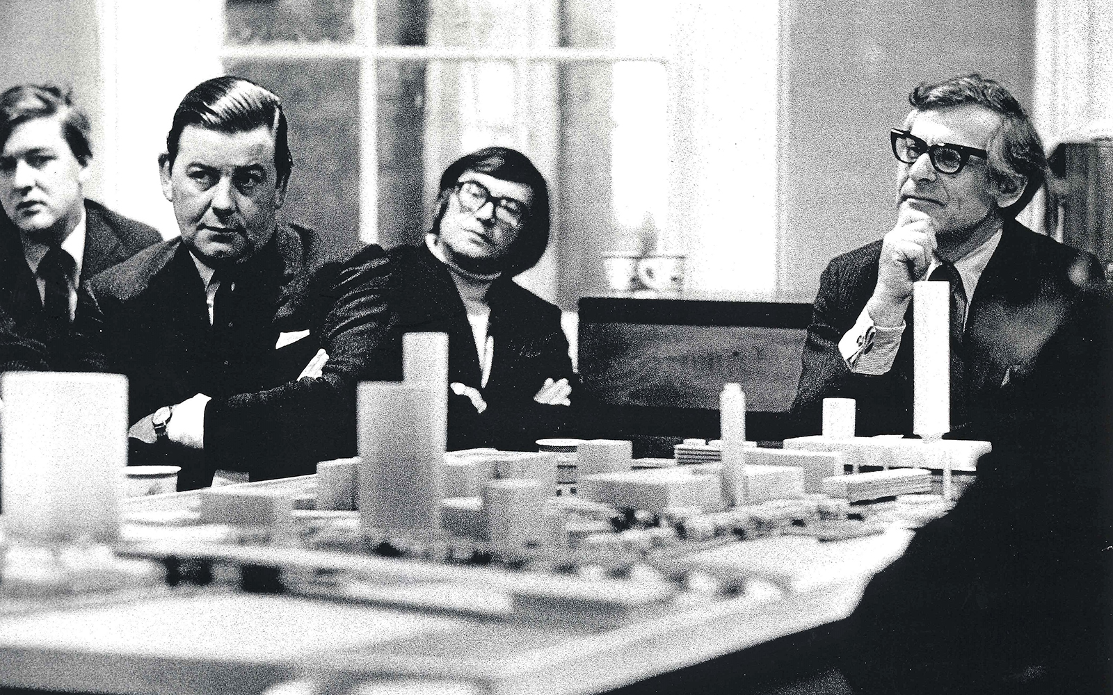 Sam Wanamaker Bankside Plans Shakespeare's Globe Theatre A group of men sit around a table, with a model plan of buildings