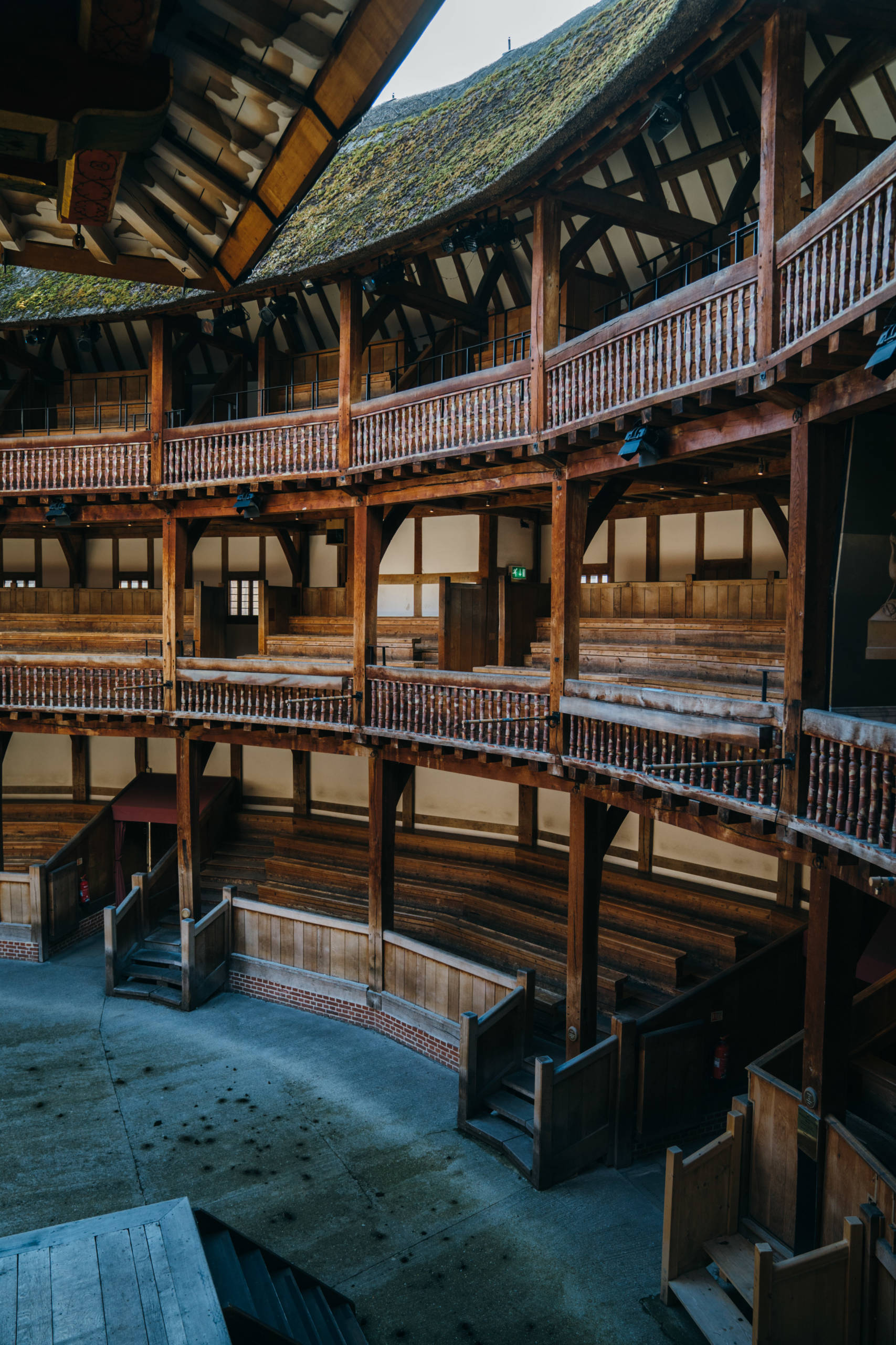 Our Empty Theatres Helen Murray Shakespeare's Globe 2 The view from the balcony of a theatre looks out to an empty seating area