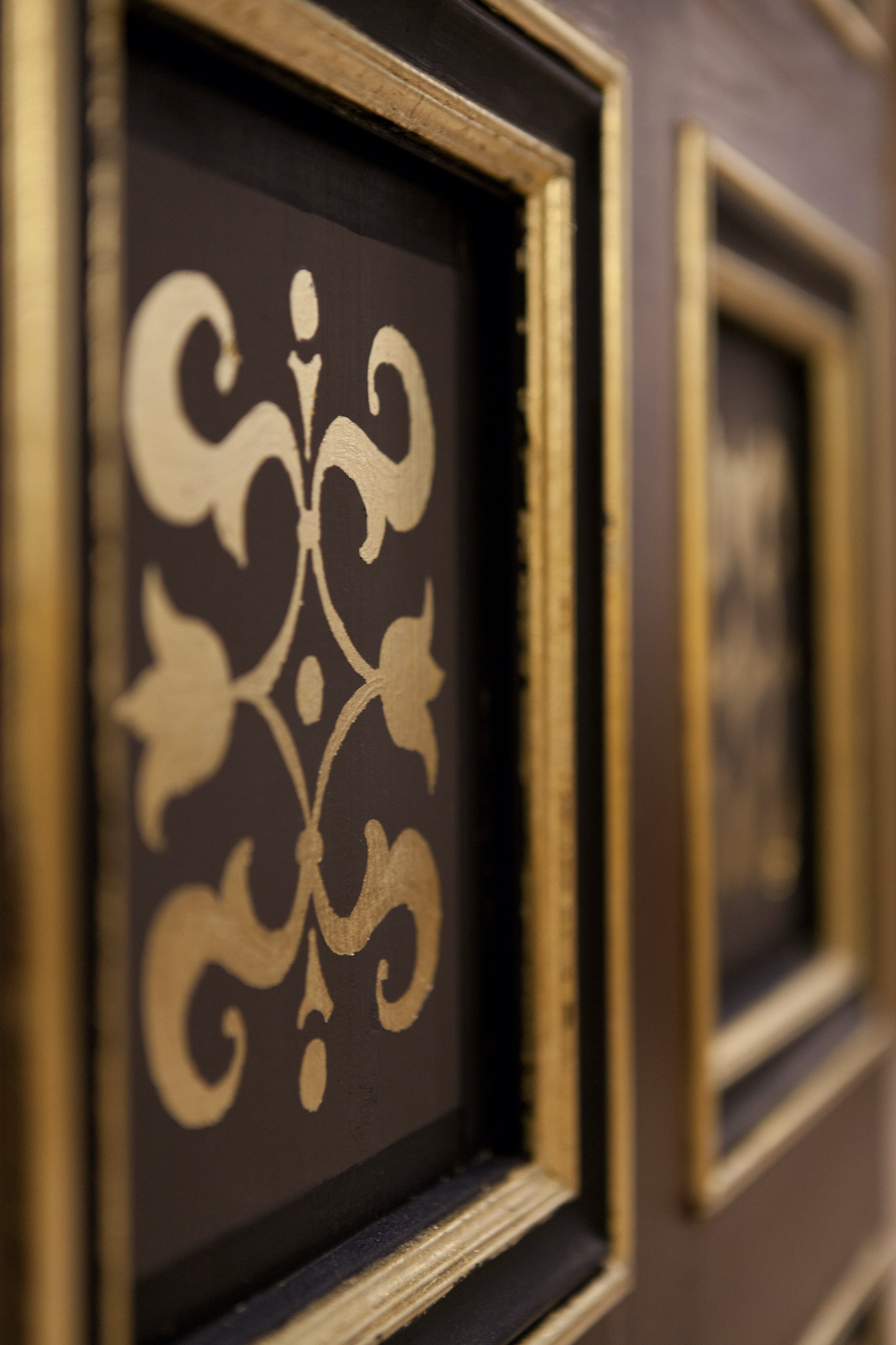 Sam Wanamaker Playhouse Pete Le May Detail on a black wall shows gold patterns