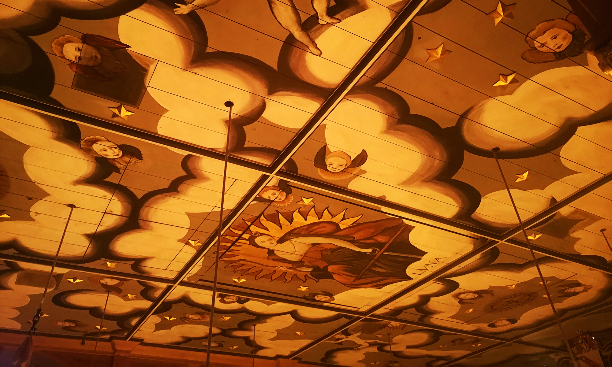 Ceiling of the Sam Wanamaker Playhouse decorated with angels and clouds