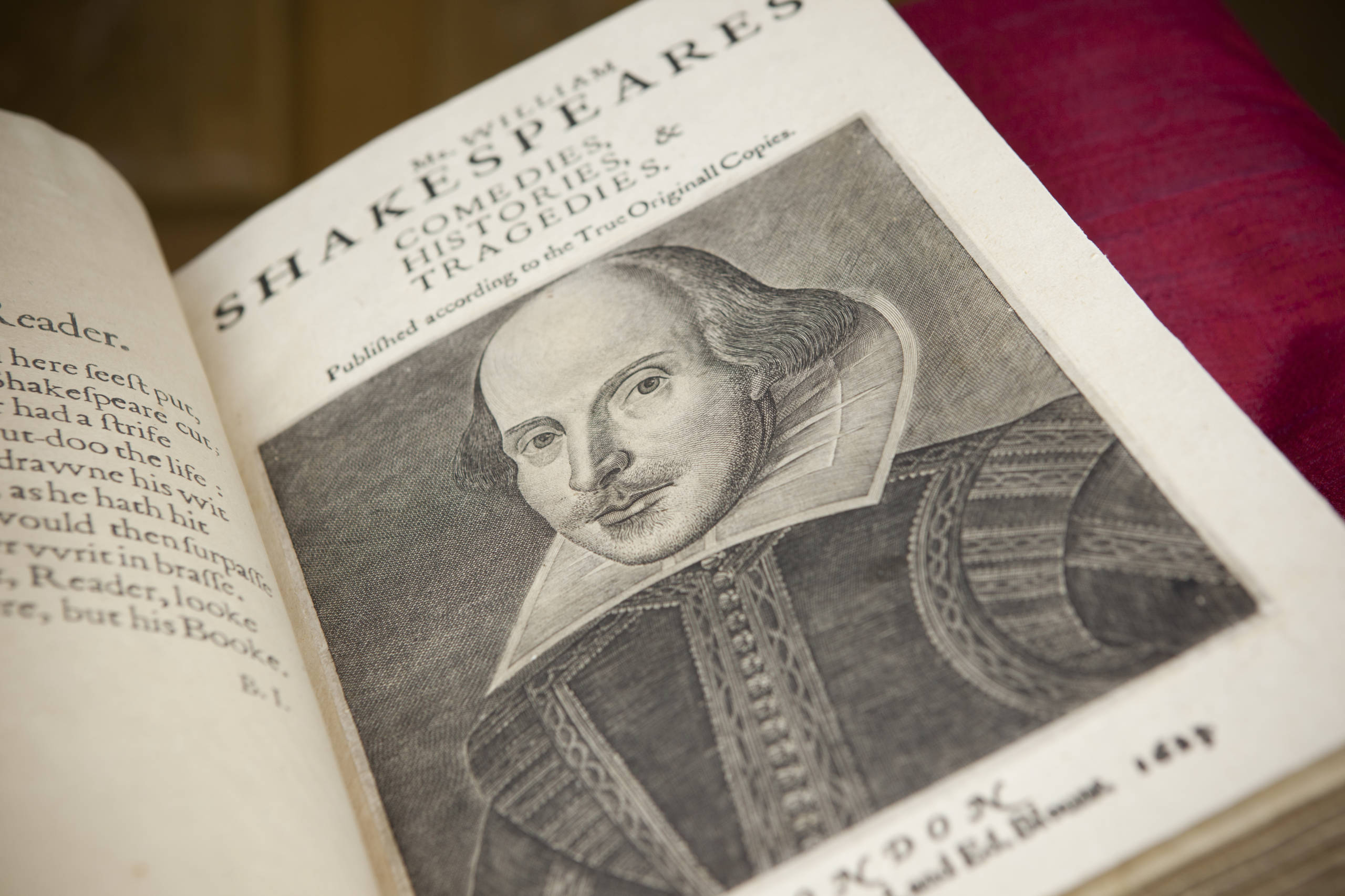 Mr. William Shakespeare's Comedies, Histories, & Tragedies, 1623 A book lies open on its title page, with an engraving of a picture of a man