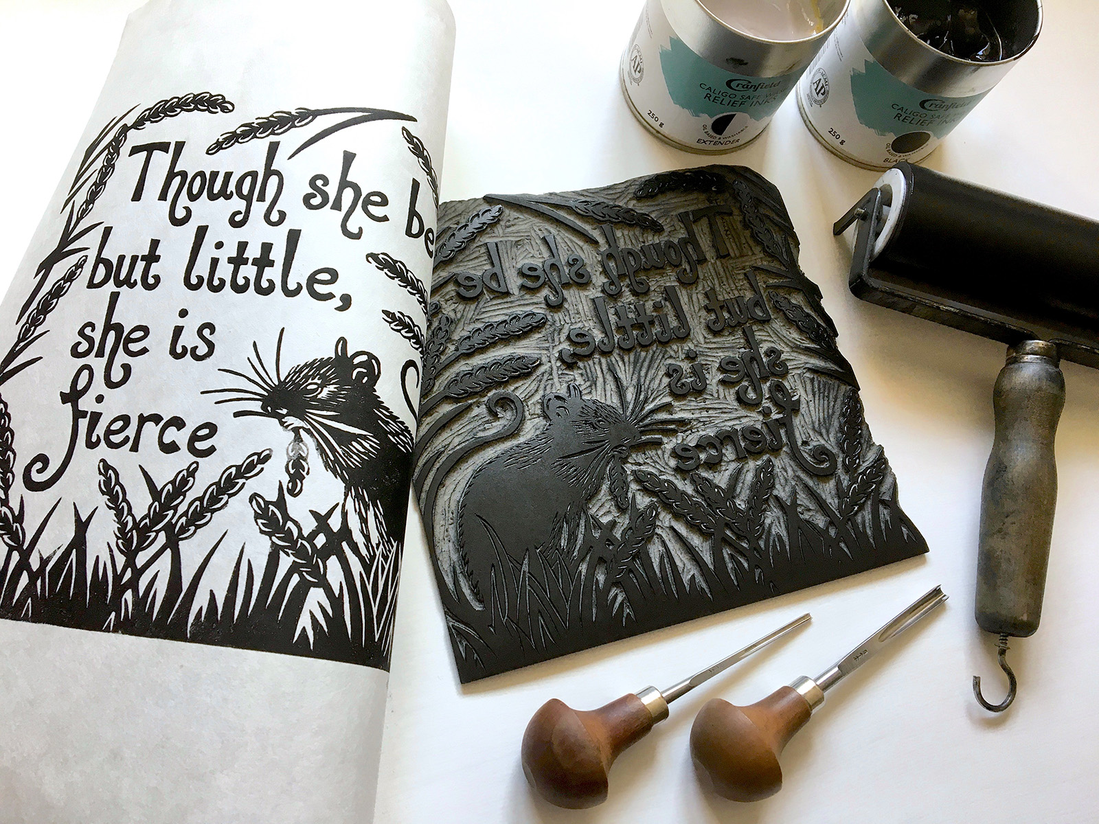 An ink print and block of a little mouse in a field with the text: Though she be but little she is fierce