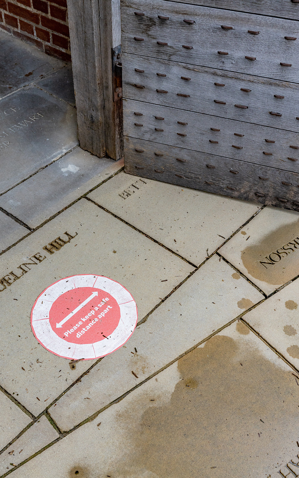 Covid Coronavirus Shakespeare’s Globe Pete Le May 2021 A red sticker on a stone floor reminds people to keep a safe distance apart from each other