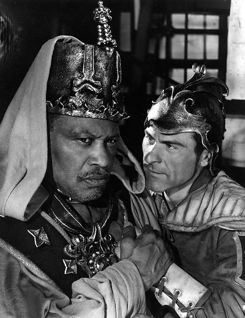 Paul Robeson Othello Sam Wanamaker Iago 1959 Shakespeare Memorial Theatre A black and white photograph of two actors, one leans in close, menacingly, towards the other.