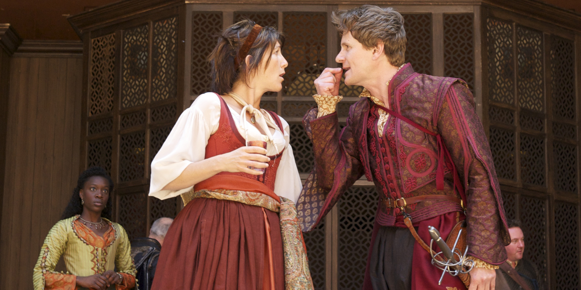 Beatrice Benedick Much Ado About Nothing 2011 Shakespeare's Globe Manuel Harlan flush A woman and a man face each other, arguing.