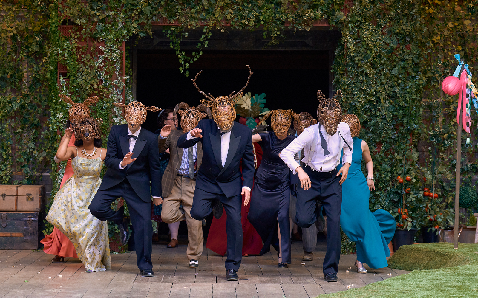 Group wearing wooden animal masks dancing