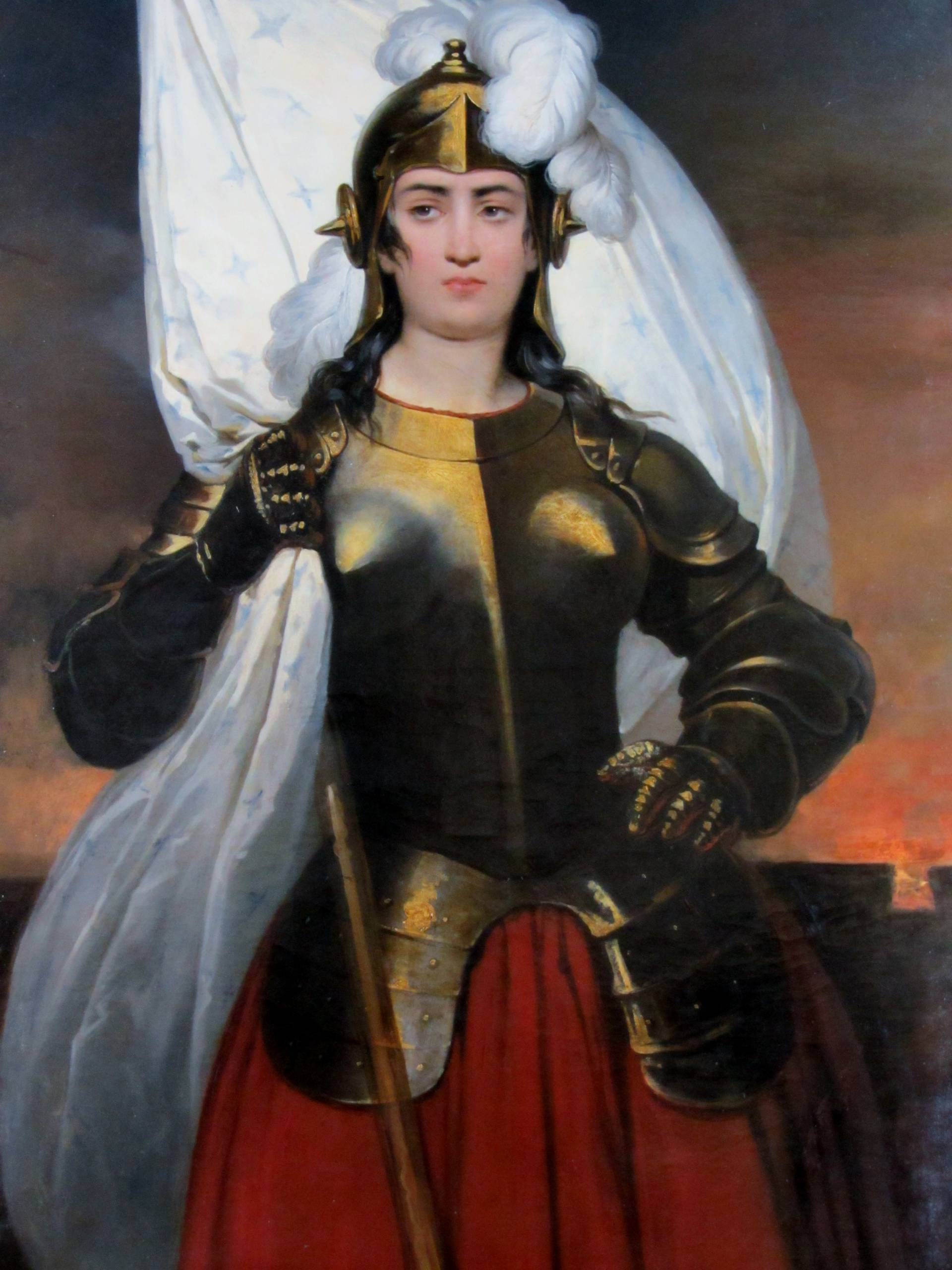 A painting of a woman in a suit of armour.
