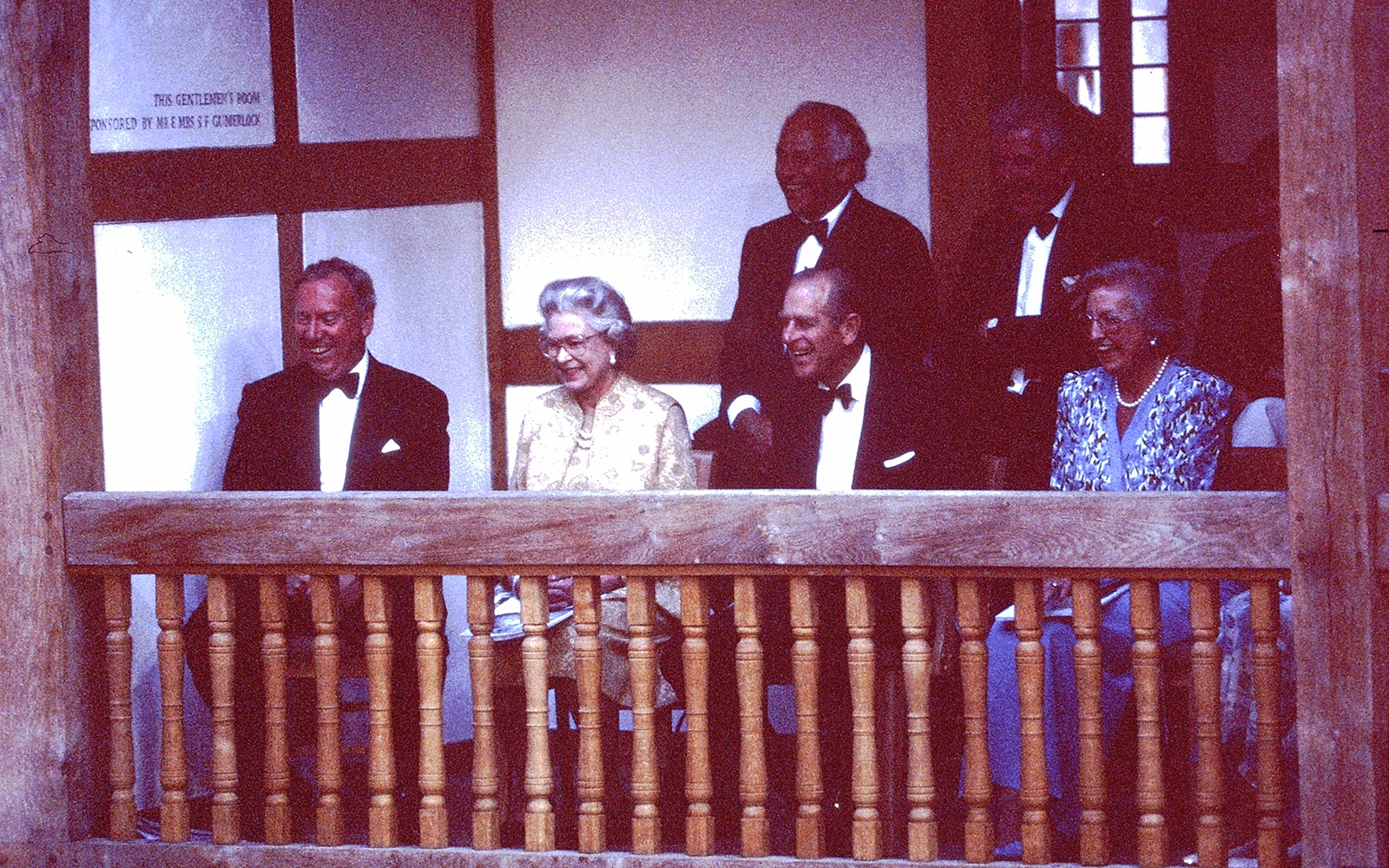 Her Majesty the Queen watches a performance in the Gentleman's Box of the Globe Theatre.